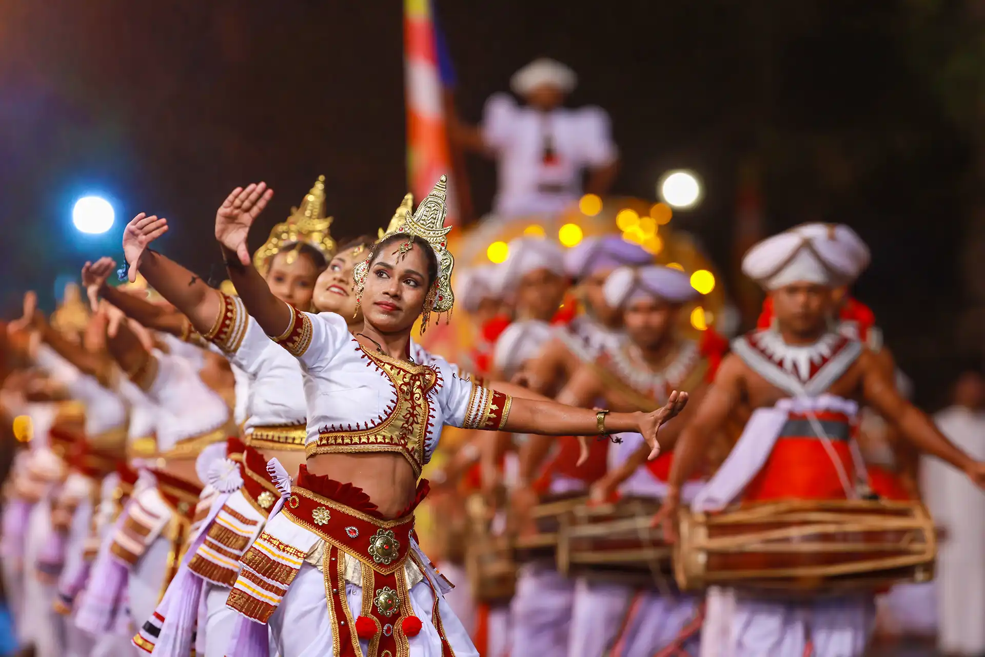 Traditional Kandyan dancers and drummers performing live, a cultural highlight of your August 2026 Kandy festival tour Sri Lanka